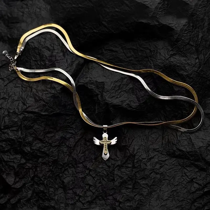 Double layered snake bone layered gold and silver cross necklace