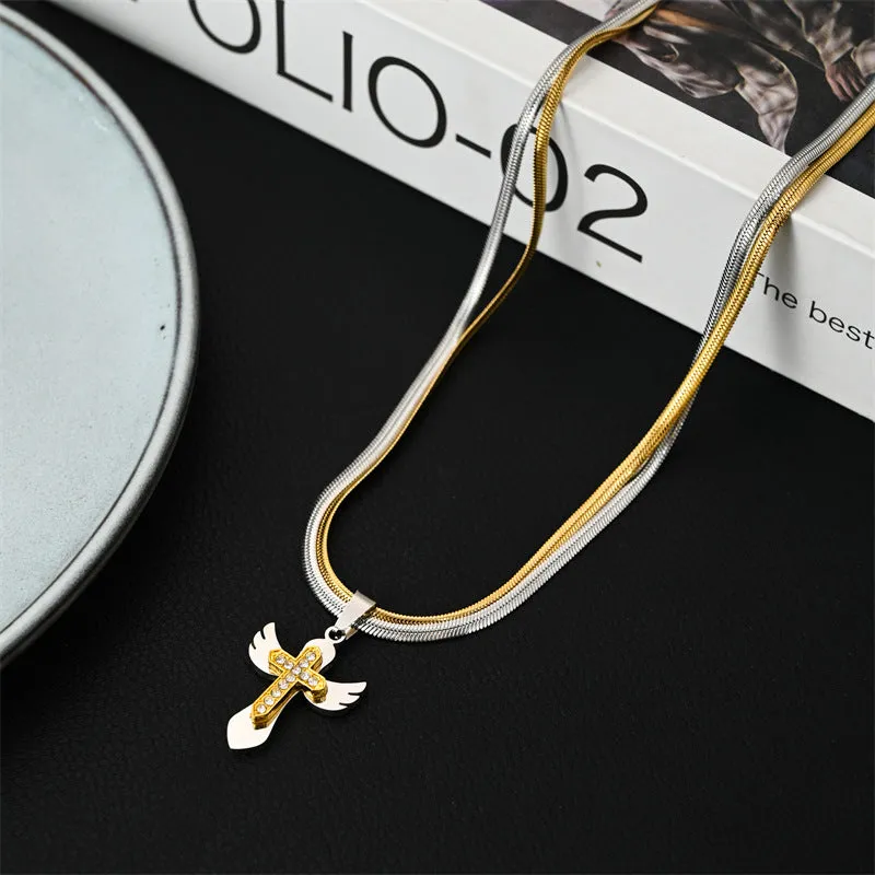Double layered snake bone layered gold and silver cross necklace