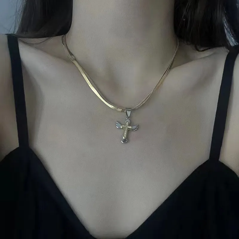 Double layered snake bone layered gold and silver cross necklace