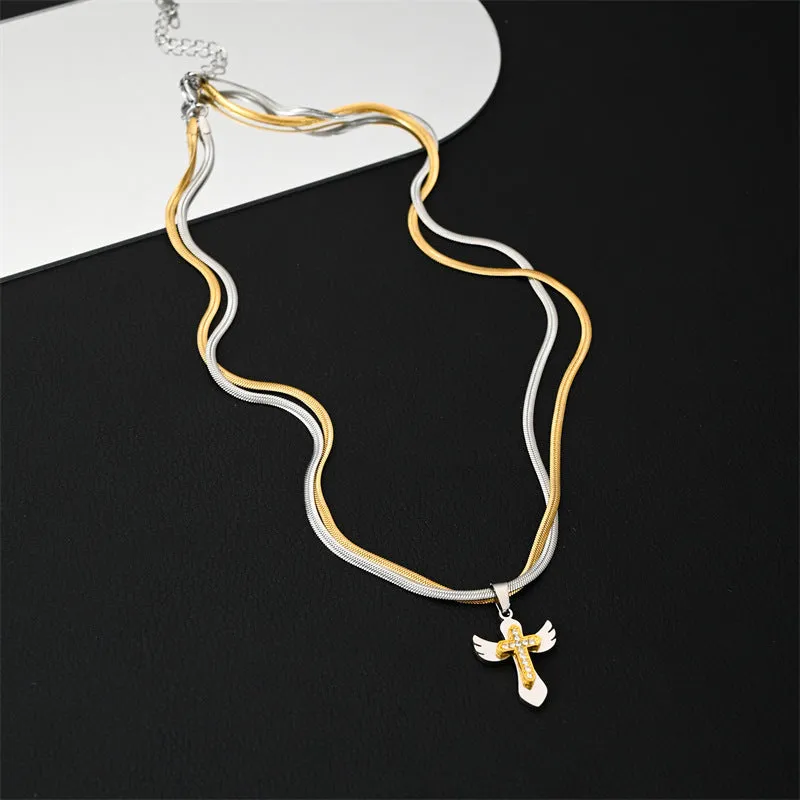 Double layered snake bone layered gold and silver cross necklace