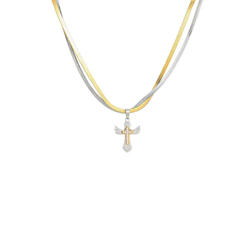 Double layered snake bone layered gold and silver cross necklace